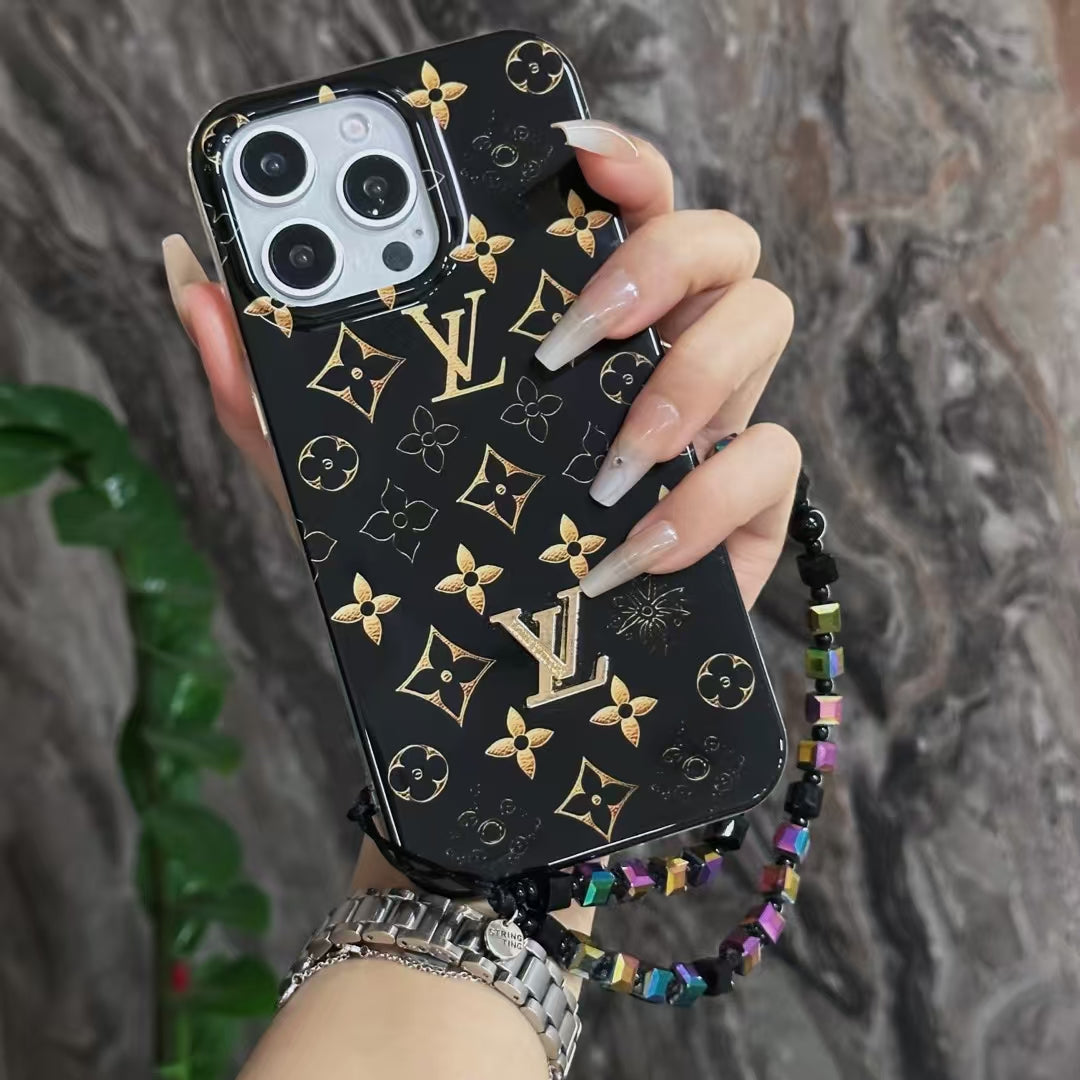 Luxury Black Monogram iPhone Case with Gold Accents and Charm Strap