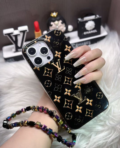 Luxury Black Monogram iPhone Case with Gold Accents and Charm Strap