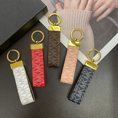 Elegant gold-tone finish on the Michael Kors keychain